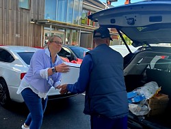 St. Vincent de Paul Group handing over August food bank donations at the YMCA building, West Bromwich.